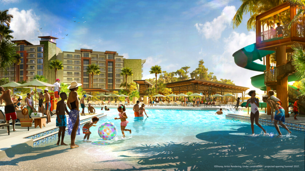 Lakeside-Lagoon-at-Disney-Lakeshore-Lodge-1536x866 - Vacation Club Life Crowded resort pool scene with families playing in the water, sun loungers, umbrellas, and a tall hotel in the background. A twisting water slide rises on the right.